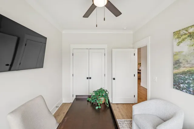 a view of a dining room with furniture window and wooden floor