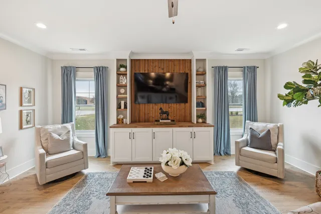 a living room with furniture and a large window