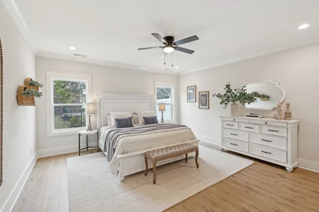a bathroom with double vanity sinks a large mirror and a shower