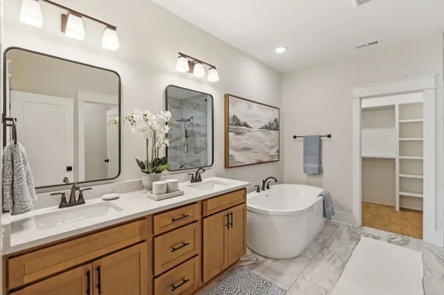 a bathroom with a shower and a glass door
