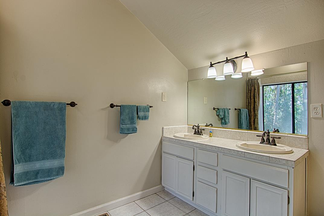 217 Gillette Road Watsonville, CA 95076 - Photo 12 of 16 a bathroom with a sink and a mirror