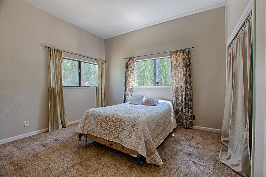 217 Gillette Road Watsonville, CA 95076 - Photo 13 of 16 a bedroom with a bed and a window