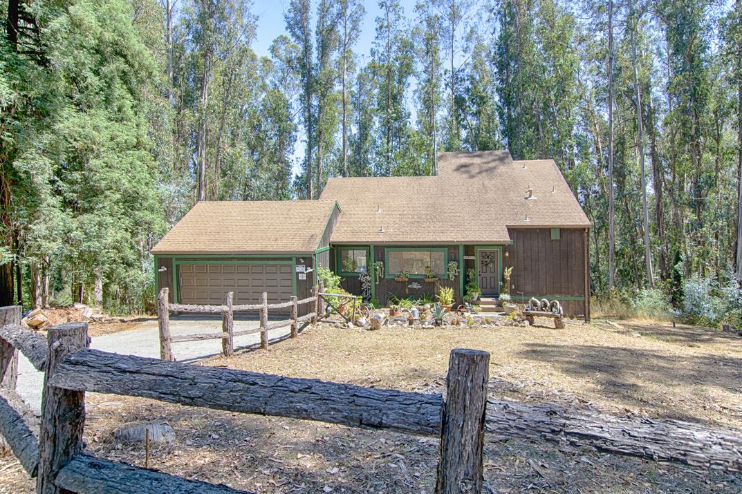 217 Gillette Road Watsonville, CA 95076 - Photo 3 of 16 a table and chairs sitting in front of a house
