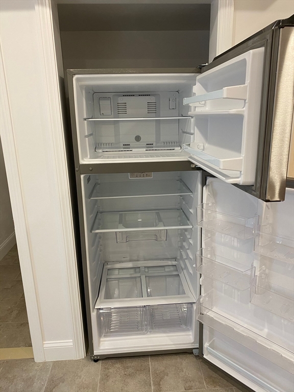 69 North Common Street, Unit 5 Lynn, MA 01902 - Photo 19 of 22 a view of walk in closet with empty racks