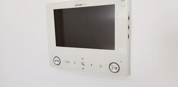 a close view of a sink a mirror and cabinets