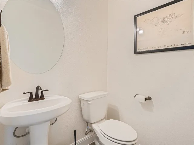a view of a dining room with furniture a chandelier and wooden floor
