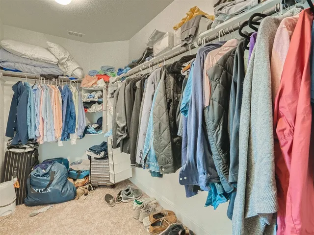 a bathroom with a sink double vanity granite and a toilet