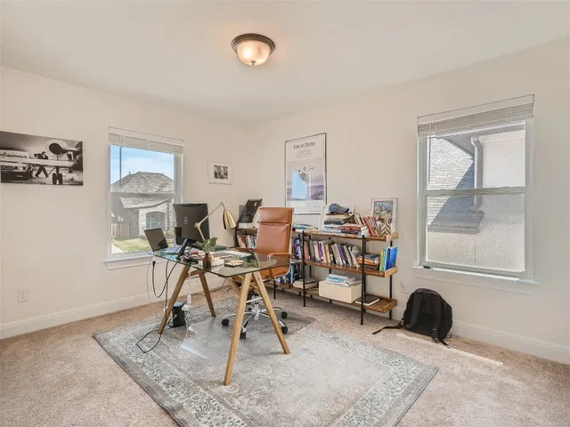a view of walk in closet with clothes