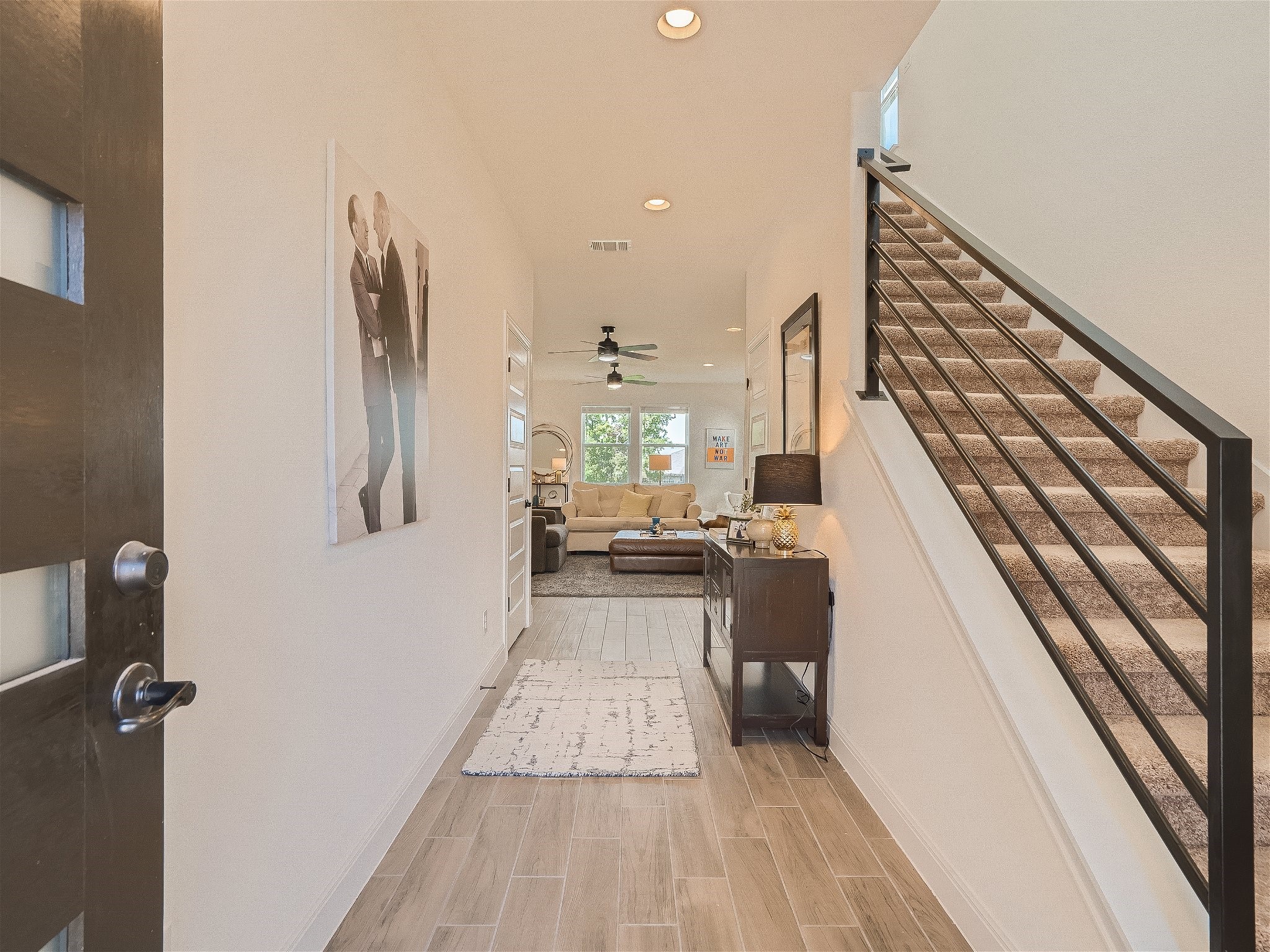 412 Arrowhead Vine Street Leander, TX 78641 - Photo 29 of 30 Upon entering the home - the Wide plank tile flooring greets you and the open floorplan welcomes you