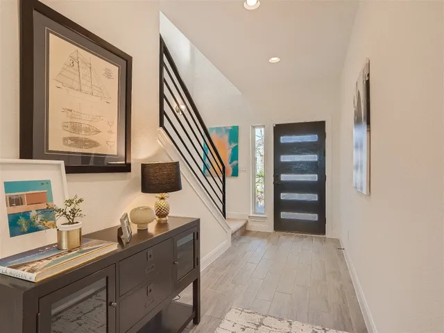 a very nice looking room with a large window and wooden floor