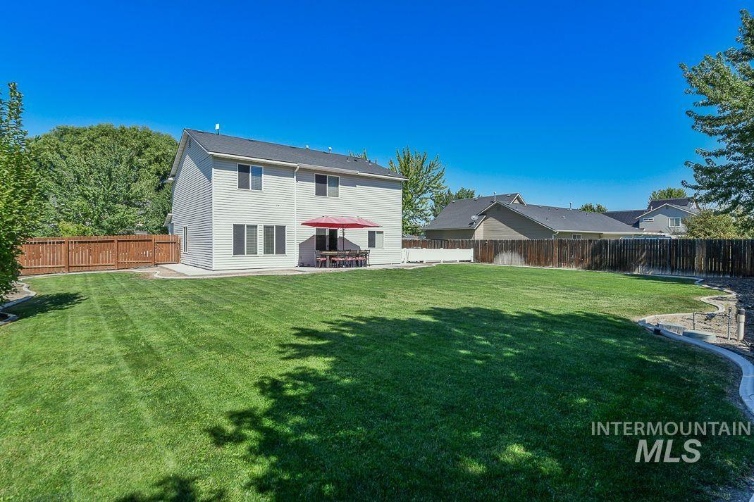 3013 Gala Trail Emmett, ID 83617 - Photo 20 of 22 Back of property with a patio and a fenced backyard