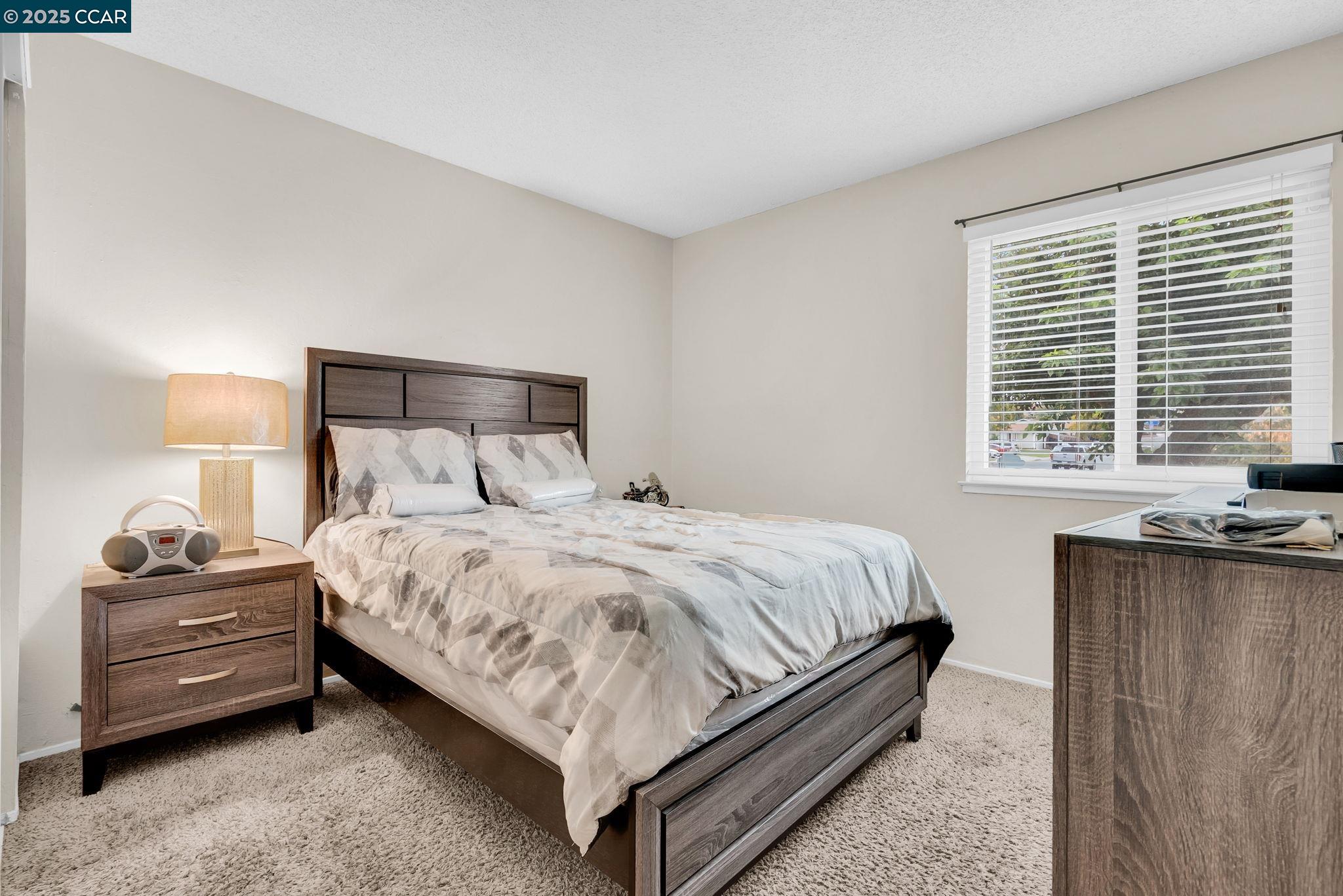 265 Tahoe Drive Rio Vista, CA 94571 - Photo 12 of 24 a bedroom with a bed and a dresser