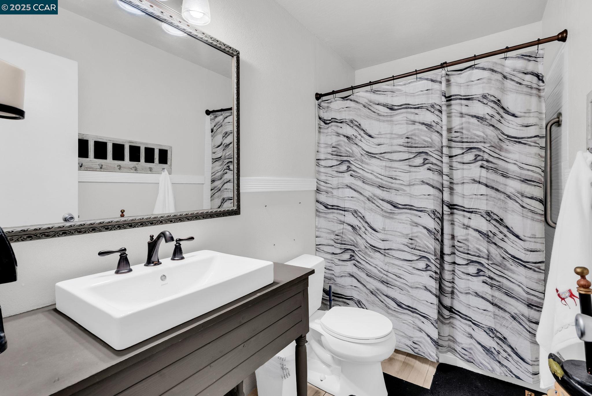265 Tahoe Drive Rio Vista, CA 94571 - Photo 14 of 24 a bathroom with a sink and a toilet