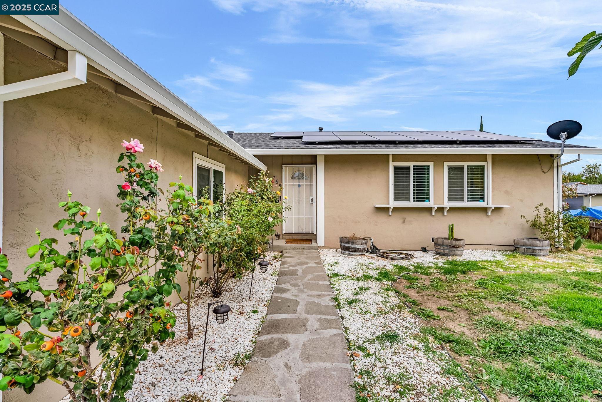 265 Tahoe Drive Rio Vista, CA 94571 - Photo 2 of 24 a front view of a house with garden