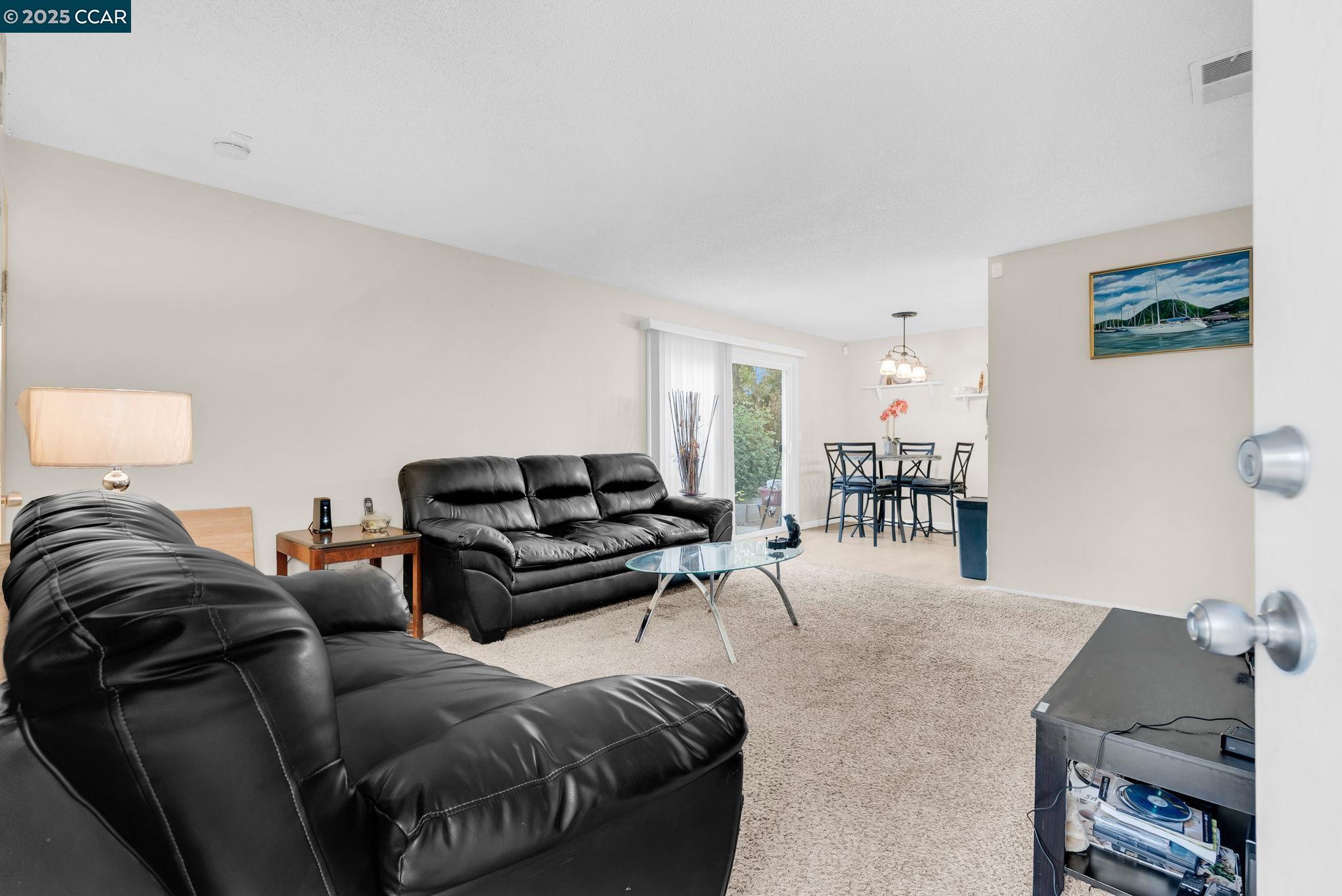 265 Tahoe Drive Rio Vista, CA 94571 - Photo 4 of 24 a living room with furniture and a table