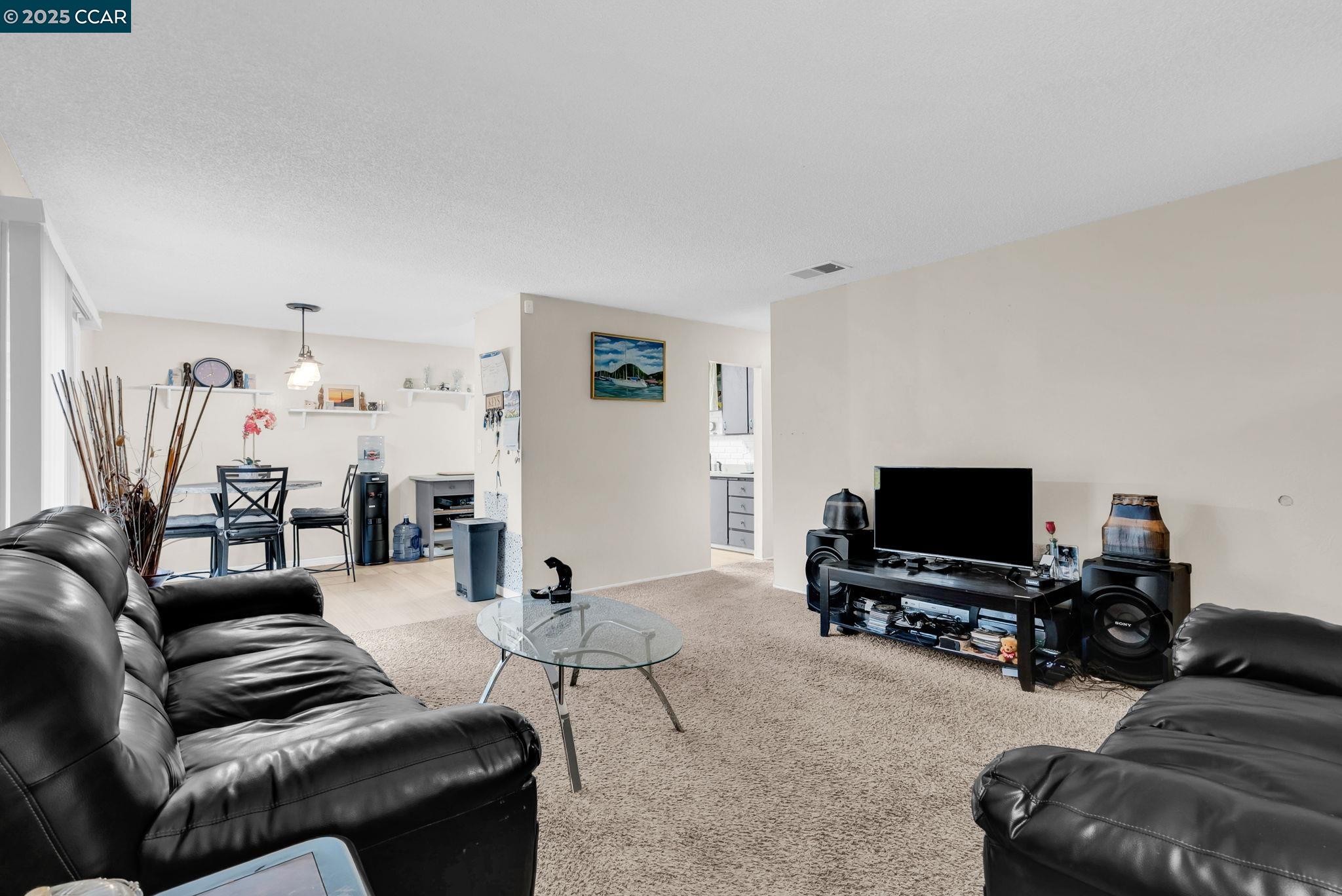 265 Tahoe Drive Rio Vista, CA 94571 - Photo 5 of 24 a living room with furniture and a flat screen tv