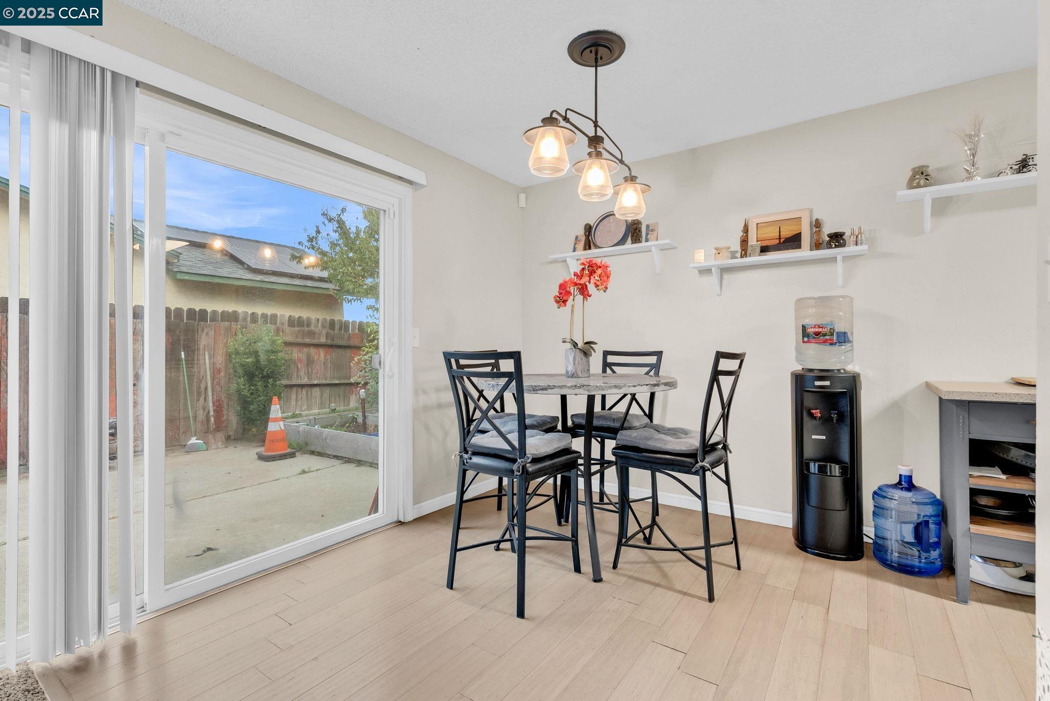 265 Tahoe Drive Rio Vista, CA 94571 - Photo 6 of 24 a dining room with furniture and a chandelier