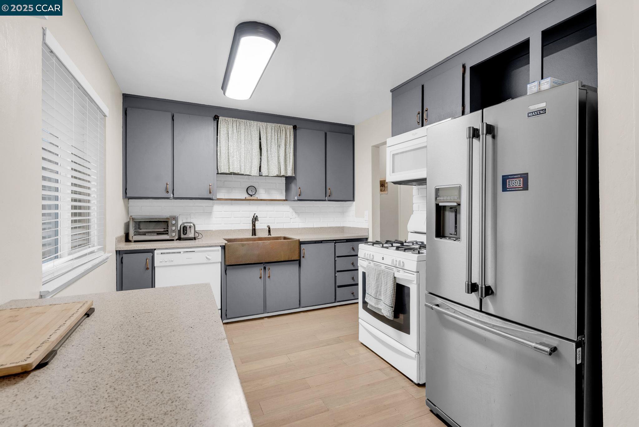 265 Tahoe Drive Rio Vista, CA 94571 - Photo 10 of 24 a kitchen with stainless steel appliances a refrigerator sink and stove