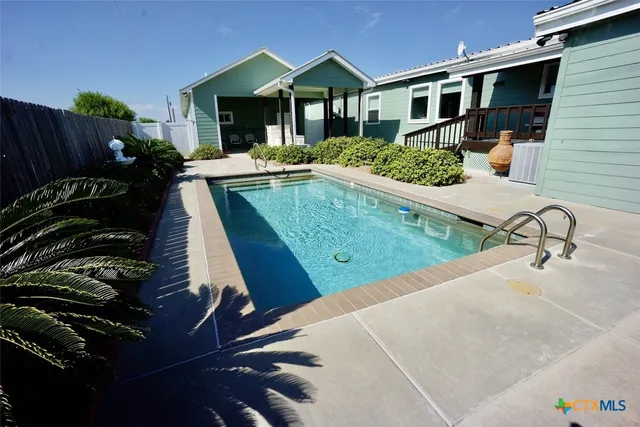 a living room with furniture rug and window