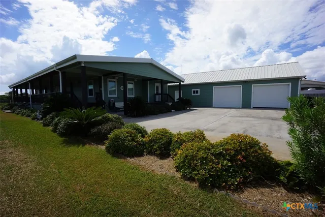 a view of house with garden space