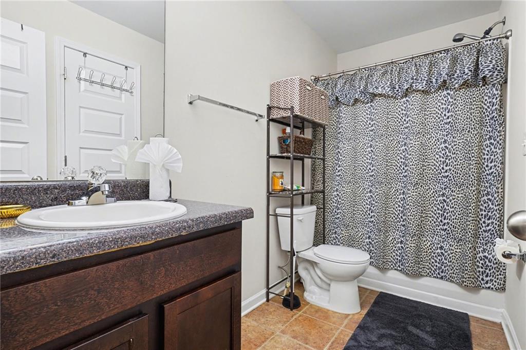 1241 England Terrace Hampton, GA 30228 - Photo 19 of 20 a bathroom with a granite countertop sink toilet and shower