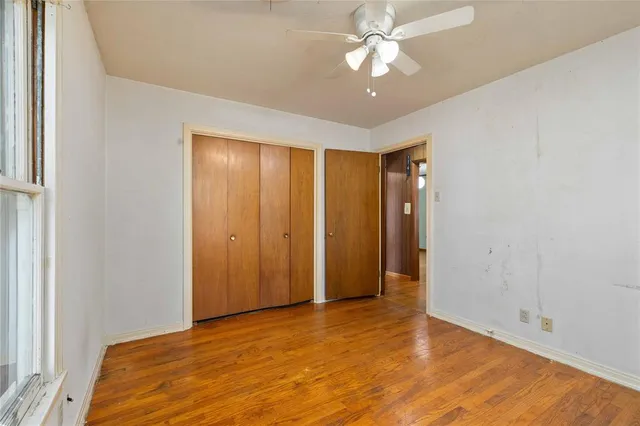 a view of a livingroom with a chandelier fan