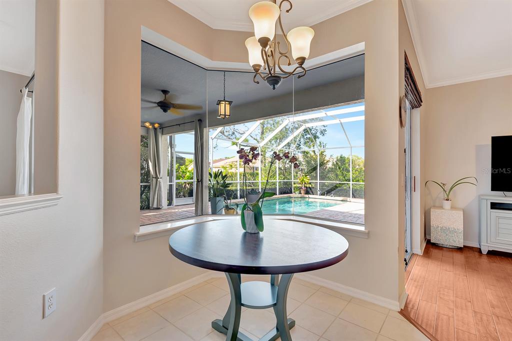 7344 Arrowhead Run Lakewood Ranch, FL 34202 - Photo 9 of 24 a view of a livingroom with furniture window and outside view