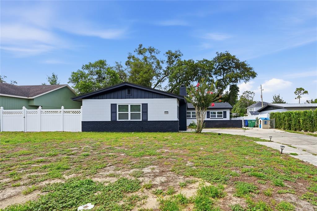 1946 Strathaven Road Winter Park, FL 32792 - Photo 30 of 37 a front view of a house with a yard and garage