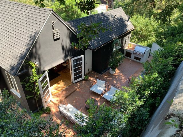 an aerial view of a house with a yard