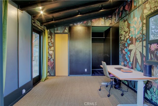 a view of a room with furniture and a potted plant