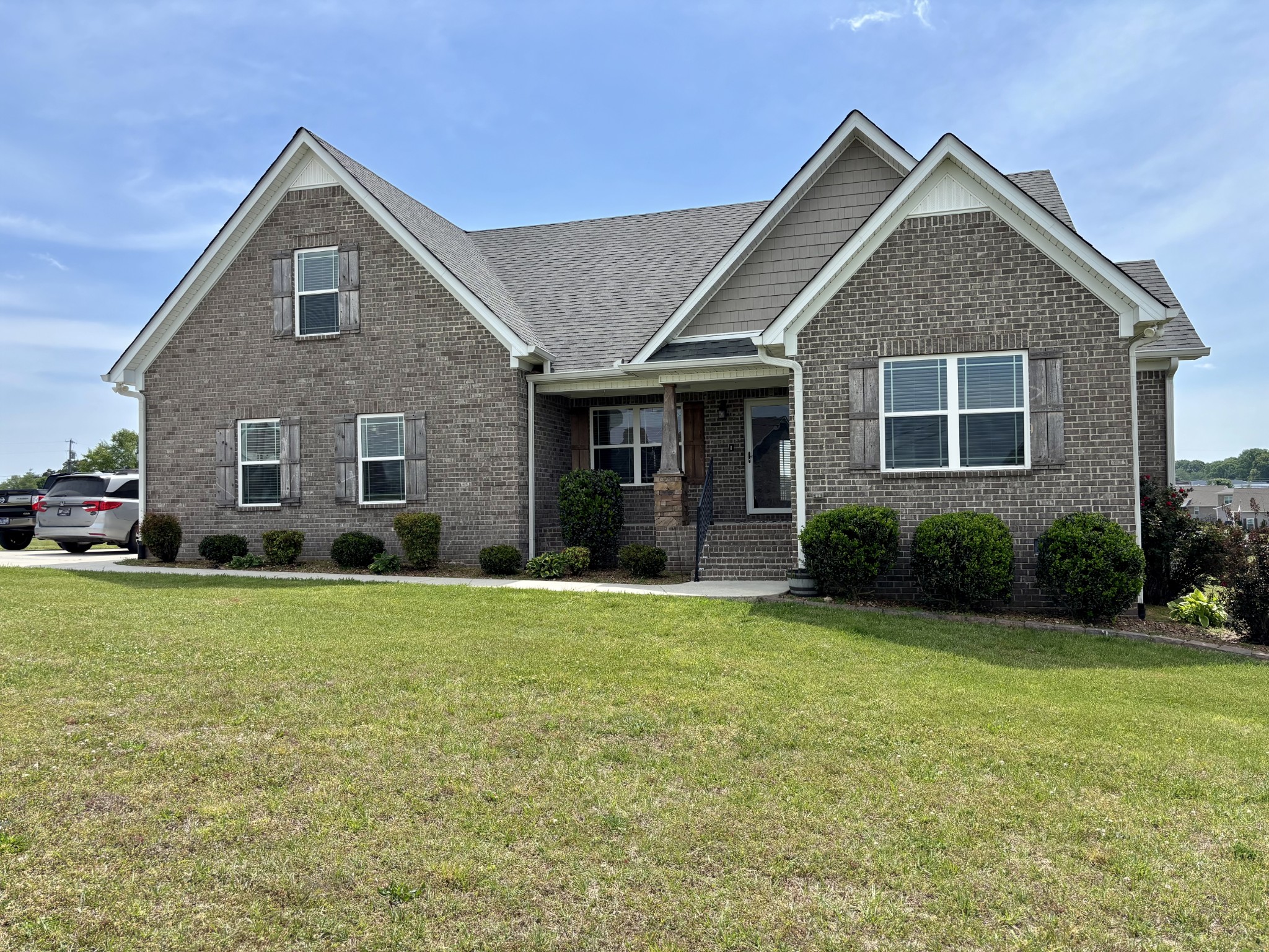 a front view of a house with a yard