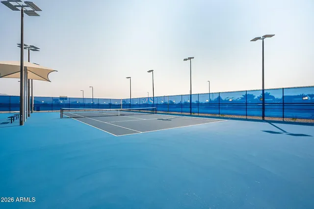 a view of an empty room with wooden cabinets
