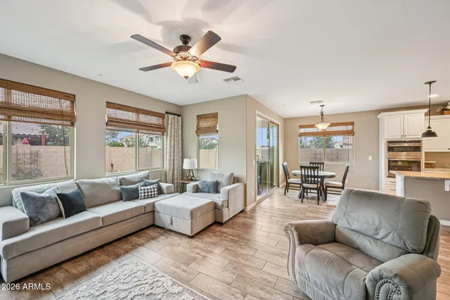 a living room with furniture and a large window