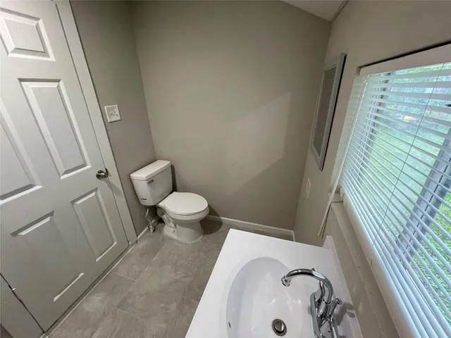 a bathroom with a sink and toilet