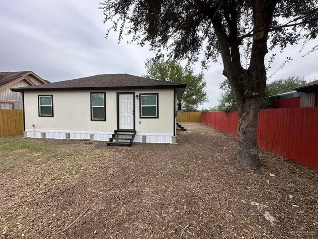 a house with trees in the background