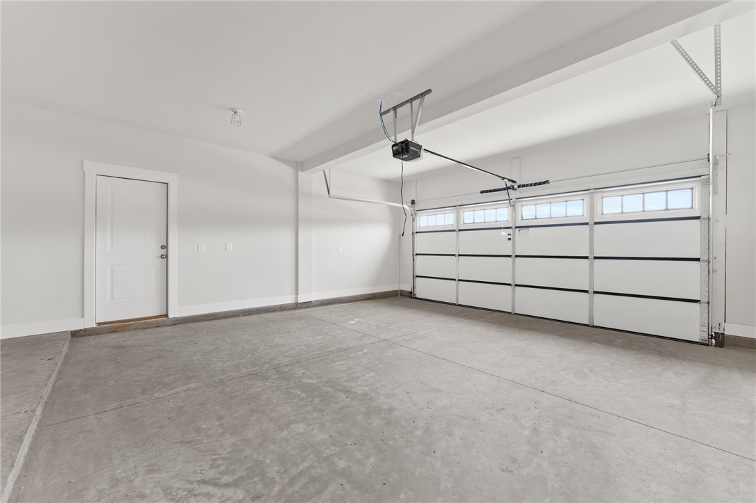 167 Tiger Lily Drive Anderson, SC 29621 - Photo 34 of 34 A spacious, newly finished garage offers ample parking and storage with a concrete floor.