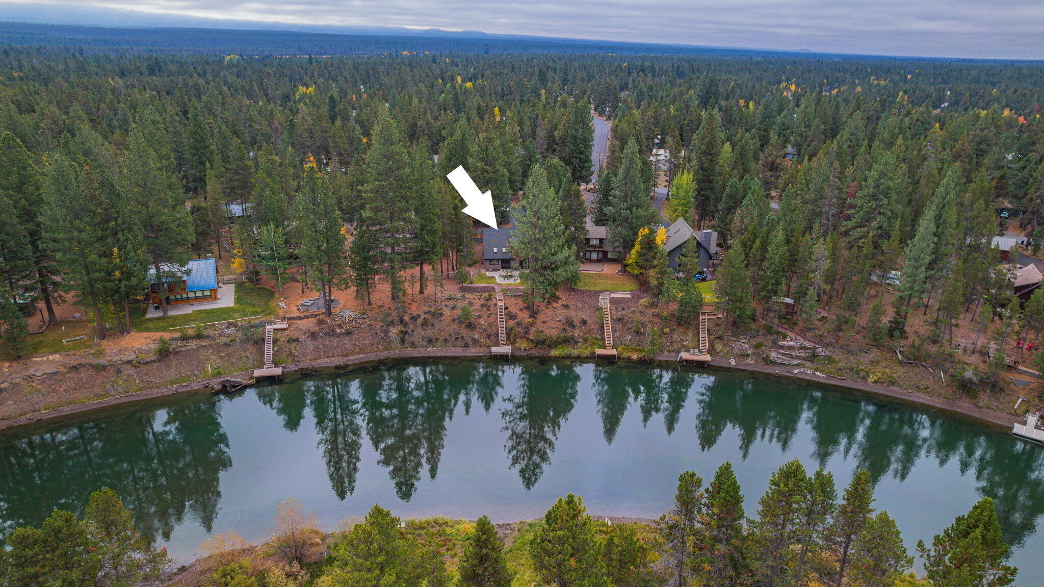 56019 Snow Goose Road Bend, OR 97707 - Photo 2 of 32 a view of a lake with a mountain in the background