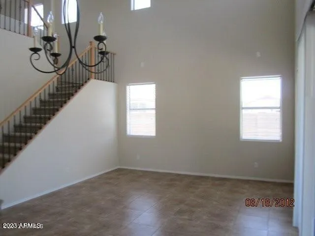 a view of staircase with railing and stairs