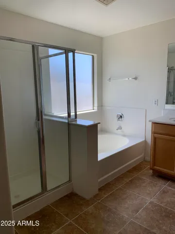 a bathroom with a sink a mirror and a bathtub