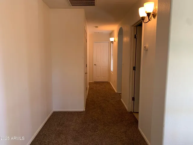 a view of storage and utility room with empty racks