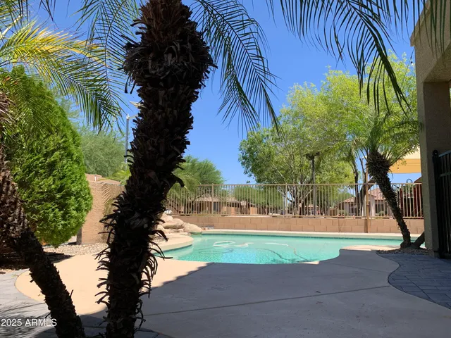 a balcony with table and chairs