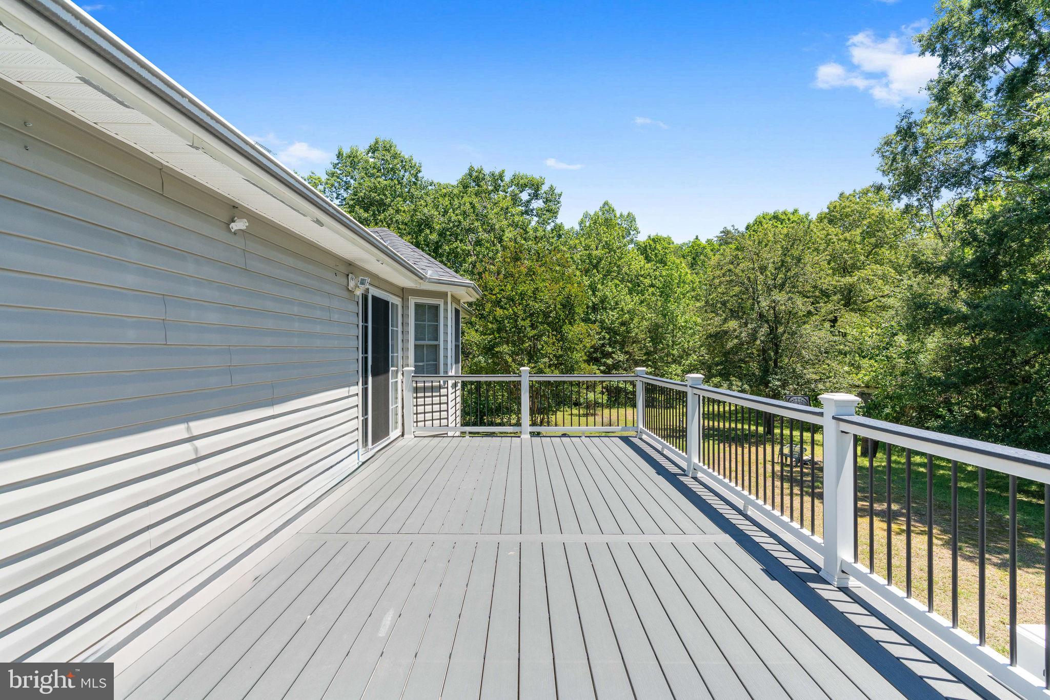 8009 Burrell Road Fredericksburg, VA 22407 - Photo 50 of 66 Spacious deck with serene woodland views.