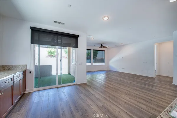 a view of a kitchen with a sink and a large window