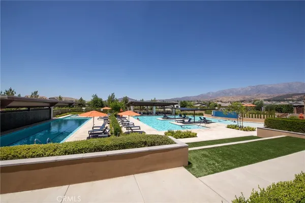 an aerial view of a house with a garden and houses