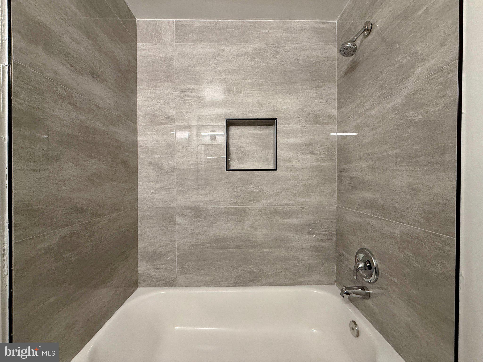 1278 Palmer Road, Unit 88 Fort Washington, MD 20744 - Photo 30 of 34 Sleek modern shower with elegant tiles.