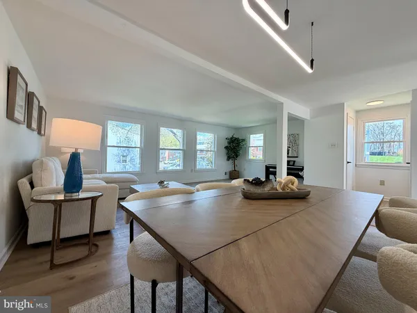 a view of a dining room with furniture and window