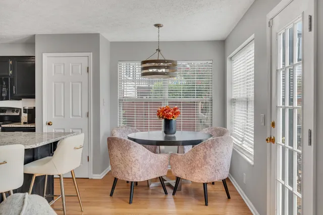 a dining room with furniture and window