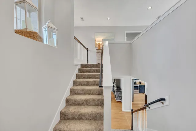 a view of staircase with white walls