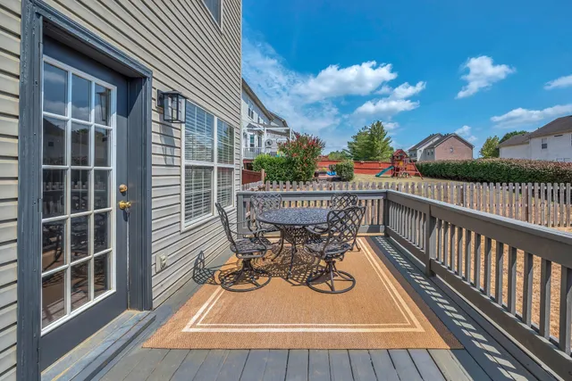 a view of balcony with furniture