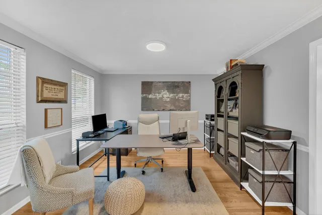 a workspace with furniture and a window